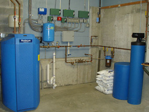 Buderus Domestic 80 gallon Hot Water System on left. Constant Pressure System in Center and Filtration/Softening System on Right