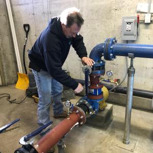 Gene installing check value on new 15 HP Installation.