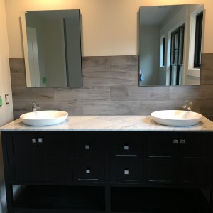 Master Bath vanity finish is a double vanity with vessel sinks and single handle faucets