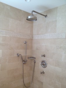 Master bath shower with rain head and hand held shower on slide bar with thermostatic valve and 2 volume controls.